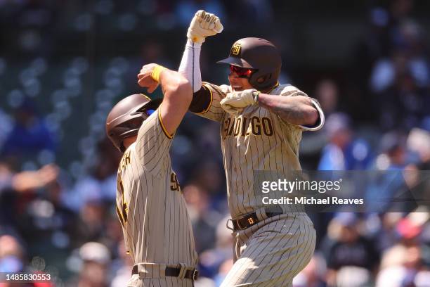 Manny Machado of the San Diego Padres celebrates a solo home run off Hayden Wesneski of the Chicago Cubs during the second inning at Wrigley Field on...