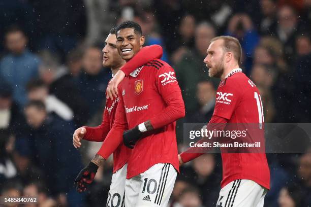 Marcus Rashford of Manchester United celebrates with Diogo Dalot and Christian Eriksen after scoring the team's second goal during the Premier League...