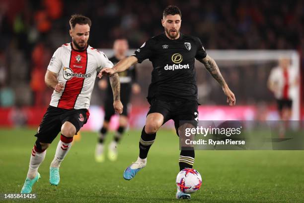Marcos Senesi of AFC Bournemouth is put under pressure by Adam Armstrong of Southampton during the Premier League match between Southampton FC and...