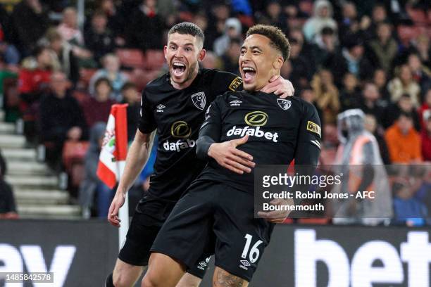 Marcus Tavernier of Bournemouth celebrates after he scores a goal to make it 1-0 with team-mate Ryan Christie during the Premier League match between...