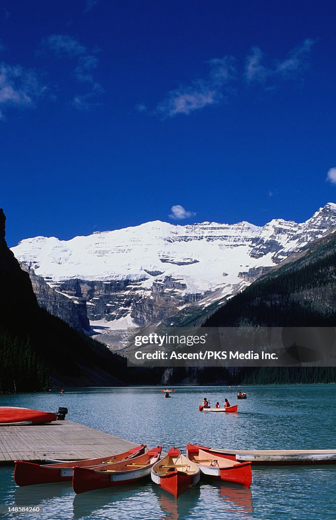 People canoeing on Lake Louise.