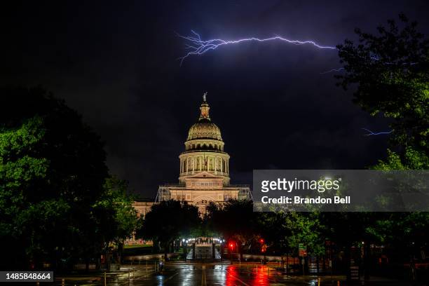Lightning flashes behind the Texas State Capitol on April 27, 2023 in Austin, Texas.