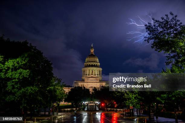 Lightning flashes behind the Texas State Capitol on April 27, 2023 in Austin, Texas.