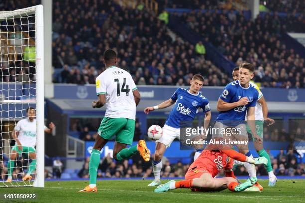 Jordan Pickford of Everton fails to stop a dribble from Alexander Isak of Newcastle United, which leads to an assist for his teammate Jacob Murphy to...