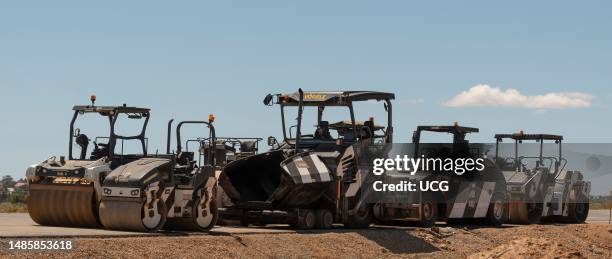 Moorreesburg, Western cape, South Africa, Road rollers and paver machine used in the road building industry parked on new asphalt.