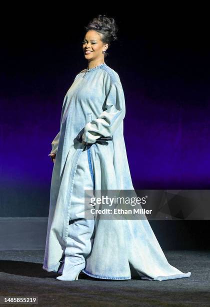 Rihanna walks onstage as she promotes the upcoming film "The Smurfs Movie" during the Paramount Pictures presentation during CinemaCon, the official...