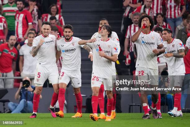 Lucas Ocampos of Sevilla FC celebrates with teammates after scoring the team's first goal during the LaLiga Santander match between Athletic Club and...