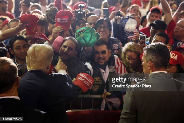 Former President Donald Trump greets supporters at a campaign rally on April 27, 2023 in Manchester, New Hampshire. Trump, who is currently dealing...