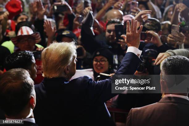 Former President Donald Trump greets supporters at a campaign rally on April 27, 2023 in Manchester, New Hampshire. Trump, who is currently dealing...