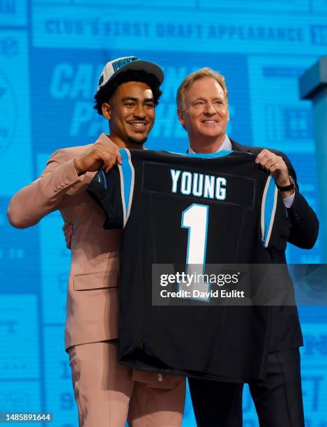 Bryce Young poses with NFL Commissioner Roger Goodell after being selected first overall by the Carolina Panthers during the first round of the 2023...