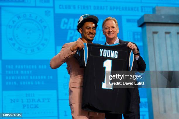 Bryce Young poses with NFL Commissioner Roger Goodell after being selected first overall by the Carolina Panthers during the first round of the 2023...