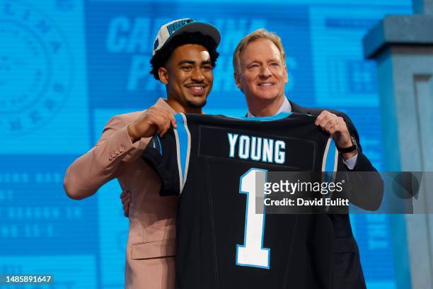 Bryce Young poses with NFL Commissioner Roger Goodell after being selected first overall by the Carolina Panthers during the first round of the 2023...