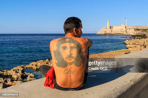 Back Che Tattoo of Che Guevara on the back of man sitting on the wall of El ...