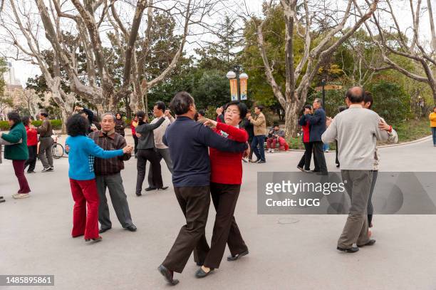 Seniors dancing in Fuxing Park, Shanghai, China.