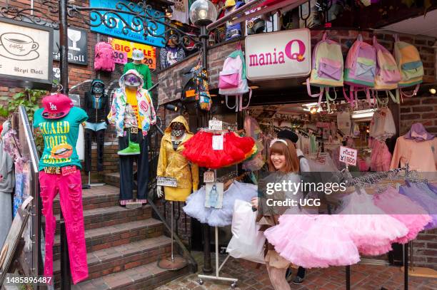 Young teenager clothes shopping in Takeshita Dori street, Harajuku, Tokyo, Japan.