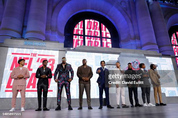 The top prospects pose onstage during the first round of the 2023 NFL Draft at Union Station on April 27, 2023 in Kansas City, Missouri.