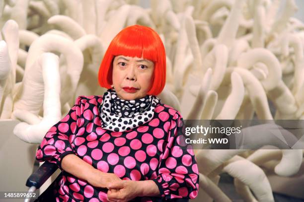 Japanese artist Yayoi Kusama at her Whitney Museum of American Art restrospective exhibit. Kusama wears Louis Vuitton.