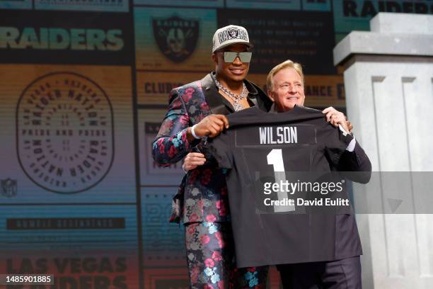Tyree Wilson poses with NFL Commissioner Roger Goodell after being selected seventh overall by the Las Vegas Raiders during the first round of the...