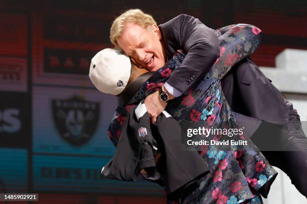 Tyree Wilson celebratewith NFL Commissioner Roger Goodell after being selected seventh overall by the Las Vegas Raiders during the first round of the...