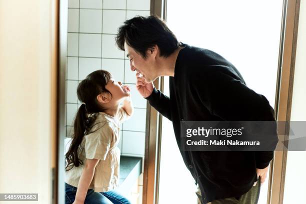 father and daughter morning - buccal cavity stock pictures, royalty-free photos & images