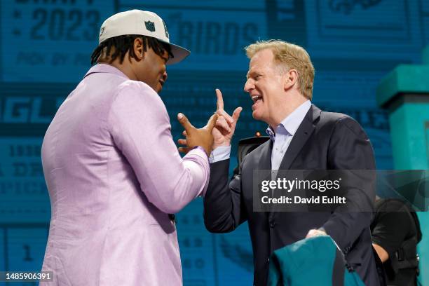 Jalen Carter celebrates with NFL Commissioner Roger Goodell after being selected ninth overall by the Philadelphia Eagles during the first round of...