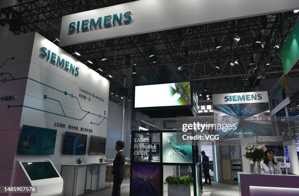 People visit Siemens booth during an achievement exhibition of the 6th Digital China Summit on April 27, 2023 in Fuzhou, Fujian Province of China.