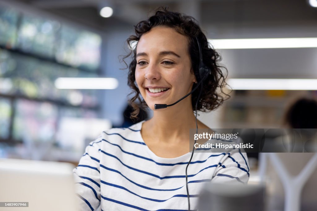 Customer service representative using a headset while working at a call center