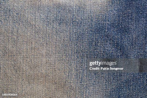 close-up of the fabric background and denim texture. - faded denim stock pictures, royalty-free photos & images