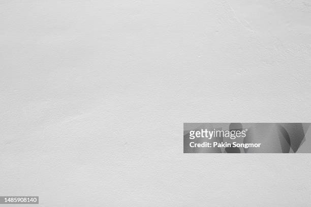 white color with an old grunge wall concrete texture as a background. - white wall stockfoto's en -beelden