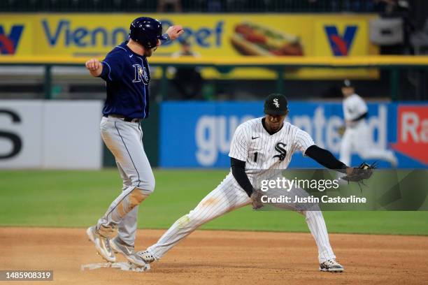 Luke Raley of the Tampa Bay Rays is save at second base as Elvis Andrus of the Chicago White Sox catches the ball at Guaranteed Rate Field on April...