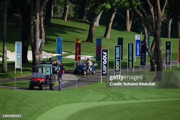 Buggies ride past team signage ahead of day one of the LIV Golf Invitational - Singapore at Sentosa Golf Club on April 28, 2023 in Singapore.