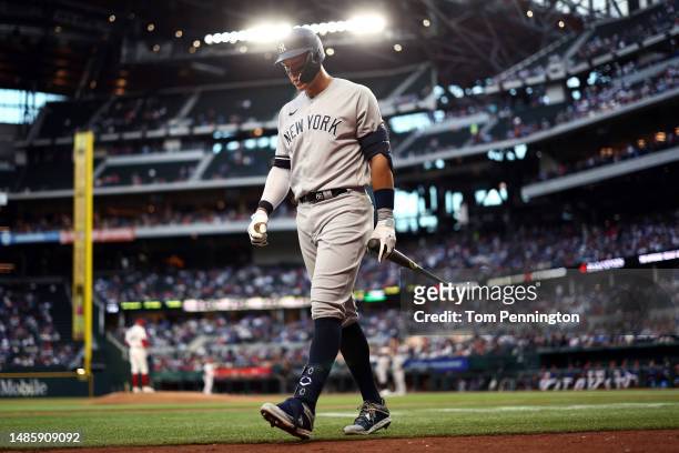Aaron Judge of the New York Yankees reacts after striking out against the Texas Rangers in the top of the second inning at Globe Life Field on April...