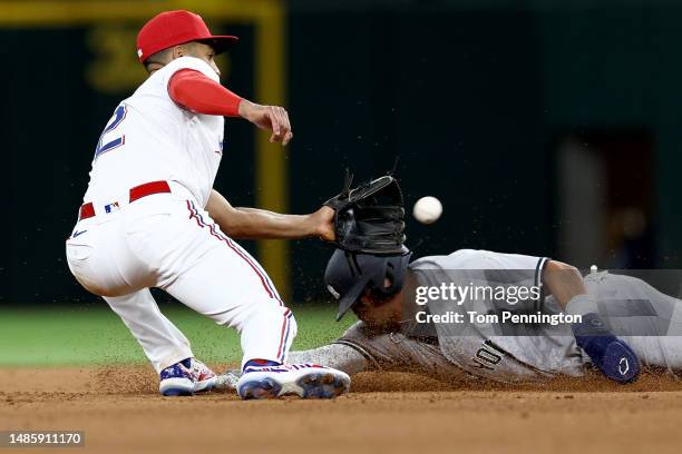 Marcus Semien of the Texas Rangers tags out Oswald Peraza of the New York Yankees while being caught stealing second base in the top of the sixth...