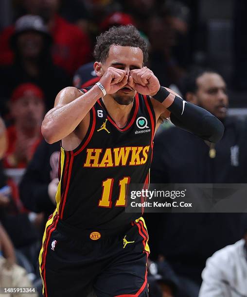 Trae Young of the Atlanta Hawks reacts after a basket against the Boston Celtics during the second quarter of Game Six of the Eastern Conference...