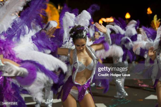 dancing woman in feathered costume at carnival parade. - carnival in portugal stock pictures, royalty-free photos & images