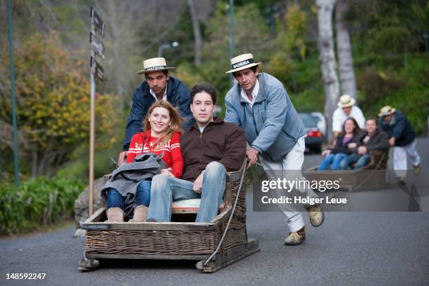 people in basket sled on monte toboggan run. - montre stock pictures, royalty-free photos & images