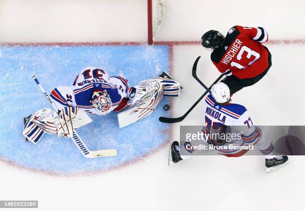 Igor Shesterkin of the New York Rangers stops Nico Hischier of the New Jersey Devils in Game Five of the First Round of the 2023 Stanley Cup Playoffs...