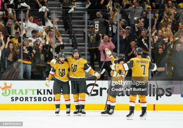 Chandler Stephenson of the Vegas Golden Knights celebrates with teammates after a goal during the second period against the Winnipeg Jets in Game...