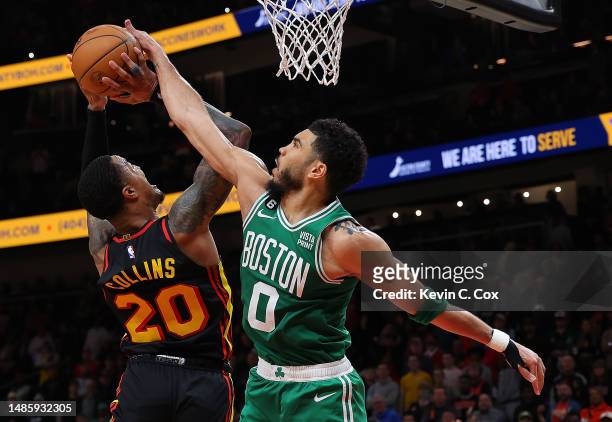 Jayson Tatum of the Boston Celtics blocks a shot by John Collins of the Atlanta Hawks during the fourth quarter of Game Six of the Eastern Conference...