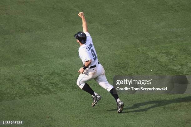 Gregg Zaun of the Toronto Blue Jays celebrates after hitting a game-winning grand slam home run in the thirteenth inning during MLB game action...