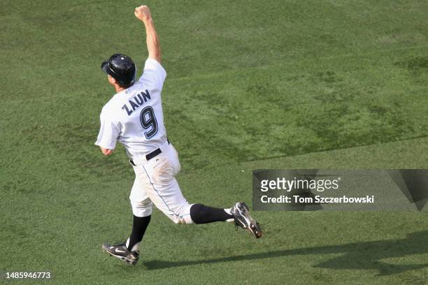 Gregg Zaun of the Toronto Blue Jays celebrates after hitting a game-winning grand slam home run in the thirteenth inning during MLB game action...