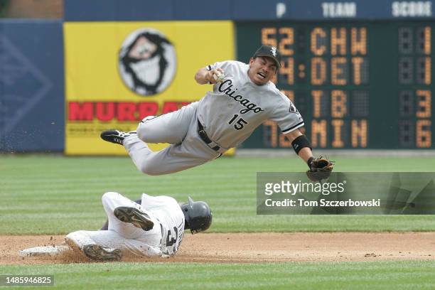 Tadahito Iguchi of the Chicago White Sox is upended by Marcus Thames of the Detroit Tigers in the seventh inning as he slides into second base and...