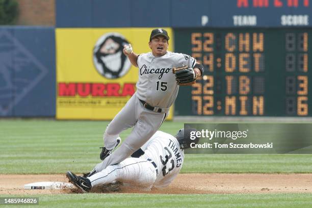 Tadahito Iguchi of the Chicago White Sox is upended by Marcus Thames of the Detroit Tigers in the seventh inning as he slides into second base and...