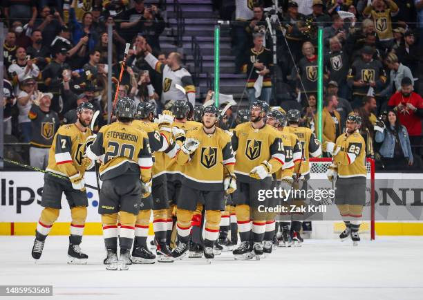 The Vegas Golden Knights celebrate after a 4-1 victory against the Winnipeg Jets in Game Five of the First Round of the 2023 Stanley Cup Playoffs at...