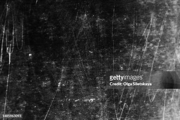 noise, damage and scratches on a black background - scratched stockfoto's en -beelden
