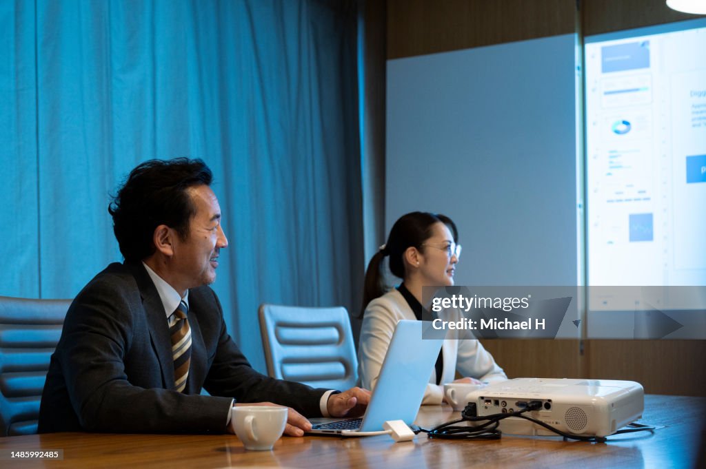 A businessman expresses his opinion in a meeting