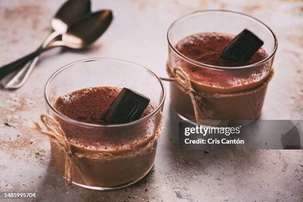 two glasses of chocolate pudding - chocolate mousse stock pictures, royalty-free photos & images