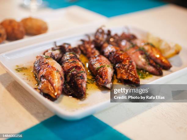 grilled baby squid - tarragona stock pictures, royalty-free photos & images