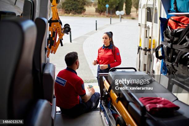 ambulance staff taking a break - emergency services equipment stock pictures, royalty-free photos & images