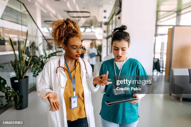 doctors working on the move - medical document stock pictures, royalty-free photos & images